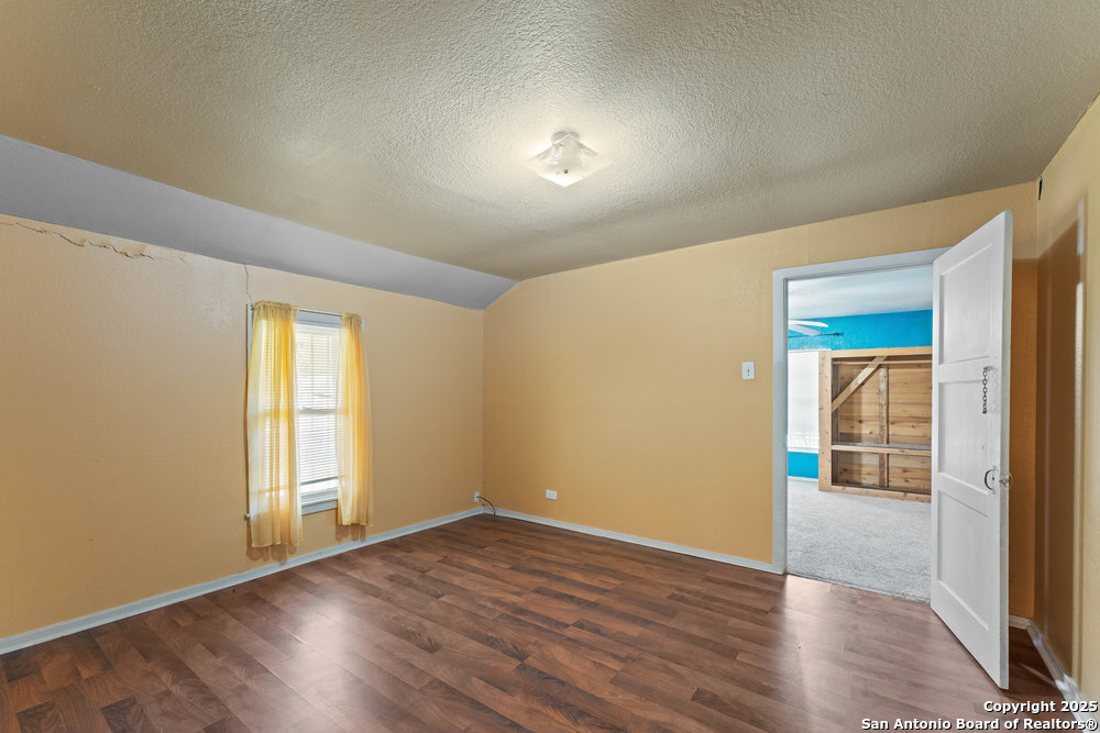 2930 Shane Road San Antonio, TX 78223 - Photo 44 of 75 an empty room with wooden floor and windows