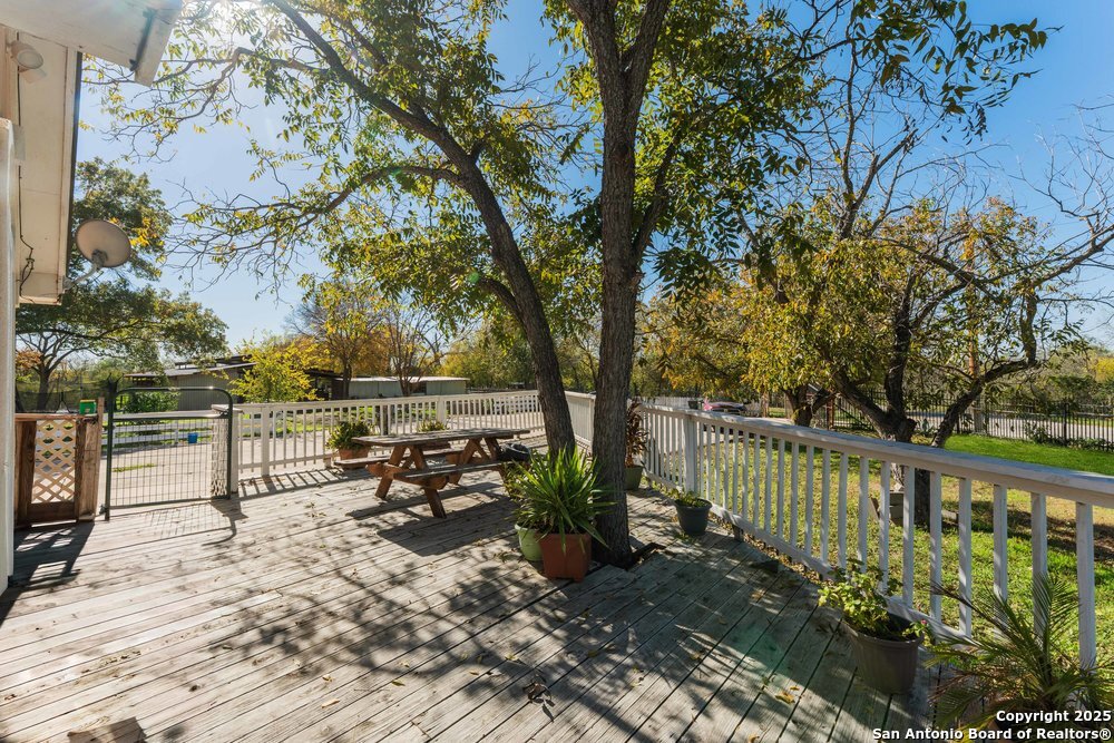 2930 Shane Road San Antonio, TX 78223 - Photo 61 of 75 a view of a lake with a bench and trees