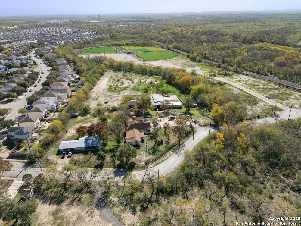 2930 Shane Road San Antonio, TX 78223 - Photo 67 of 75 an aerial view of residential houses with outdoor space and trees