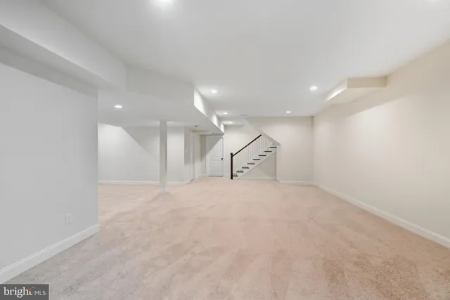 a view of a house with snow on the road