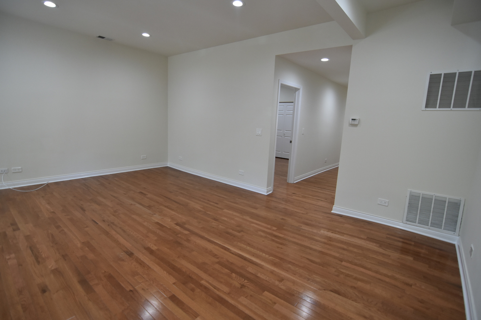 732 West Grace Street, Unit 2W Chicago, IL 60613 - Photo 8 of 15 an empty room with wooden floor and closet