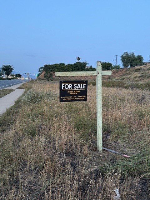 92399 Yucaipa Boulevard Yucaipa, CA 92399 - Photo 1 of 3 a view of a dry yard with trees