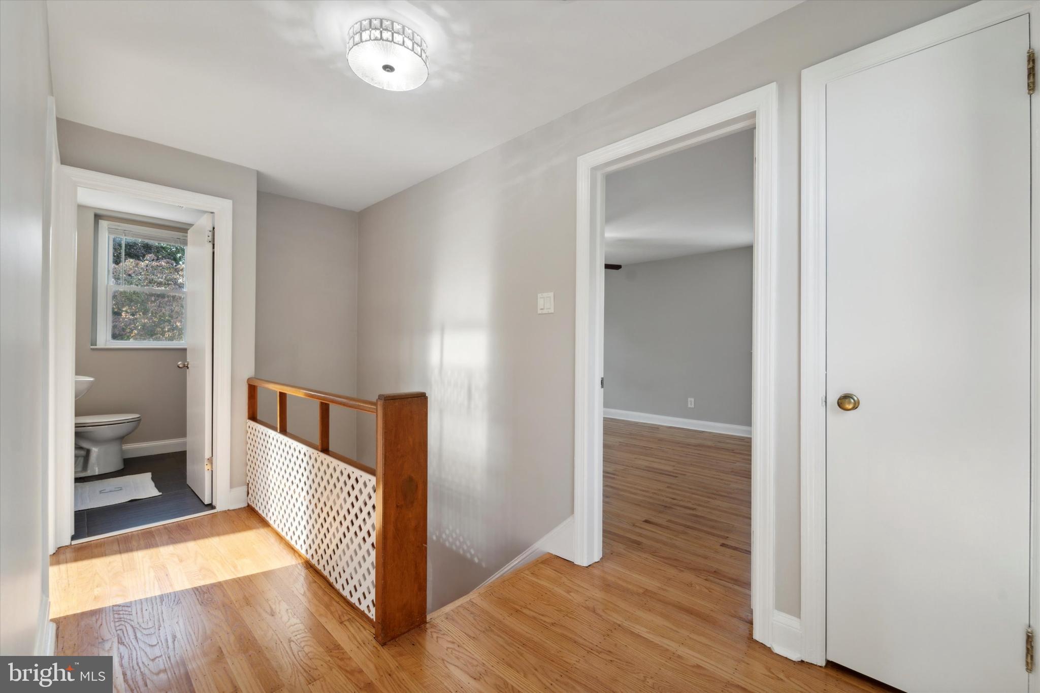 1718 Mt Pleasant Road Havertown, PA 19083 - Photo 11 of 30 a view of a hallway with wooden floor and a bedroom
