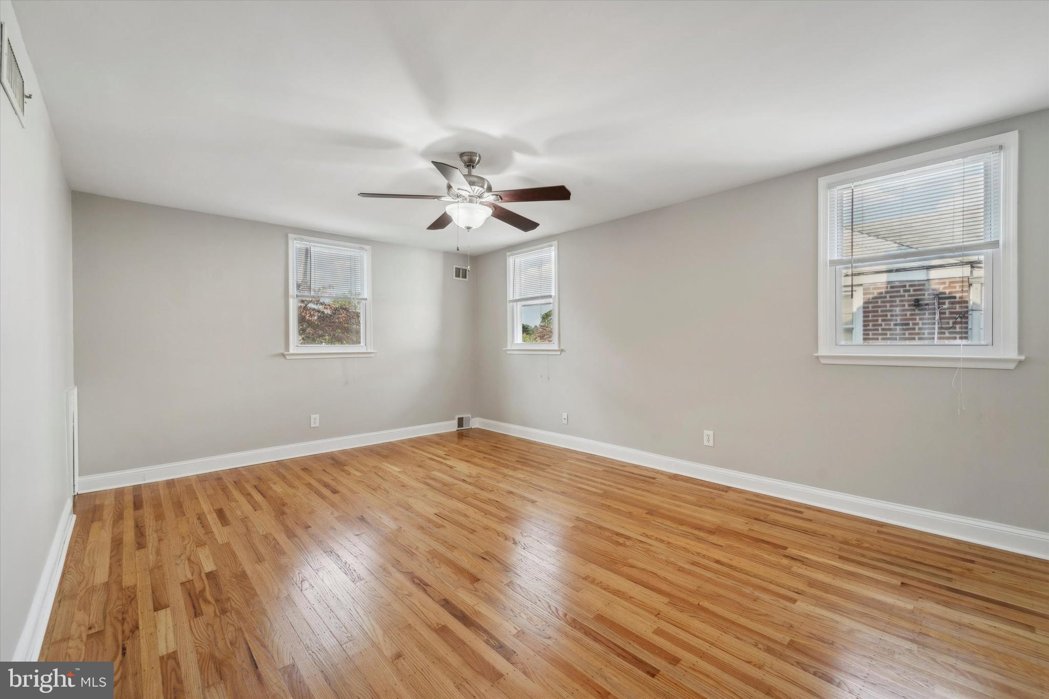 1718 Mt Pleasant Road Havertown, PA 19083 - Photo 12 of 30 a view of an empty room with wooden floor and a window