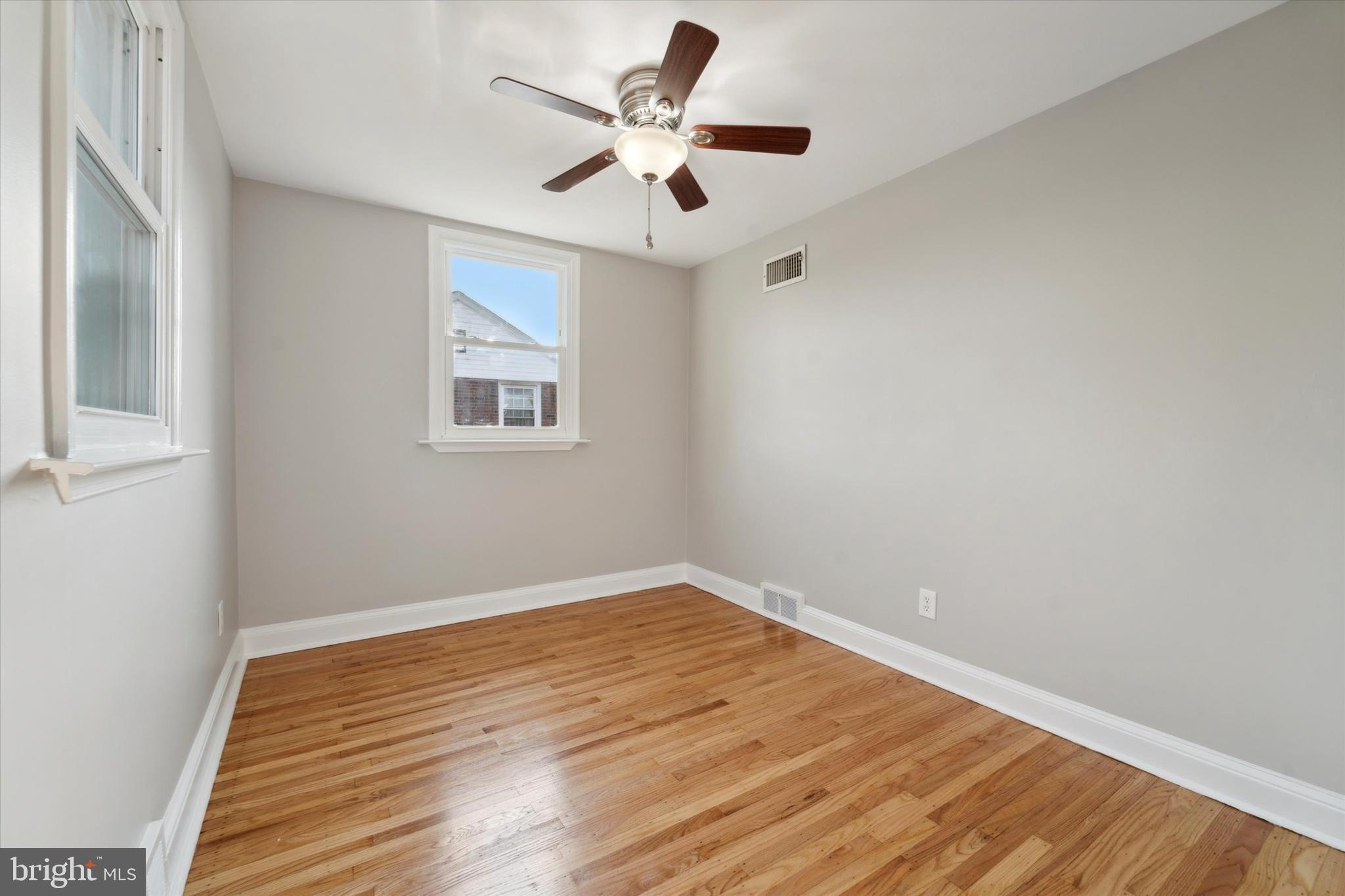 1718 Mt Pleasant Road Havertown, PA 19083 - Photo 18 of 30 a view of room with wooden floor and ceiling fan