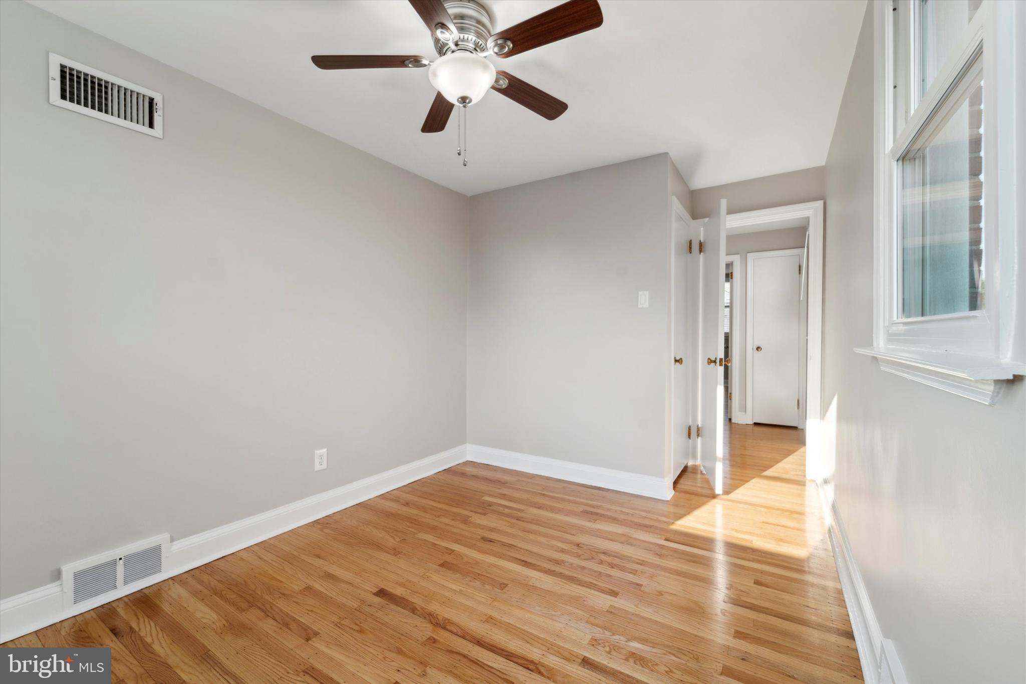 1718 Mt Pleasant Road Havertown, PA 19083 - Photo 19 of 30 a view of a room with wooden floor and white walls