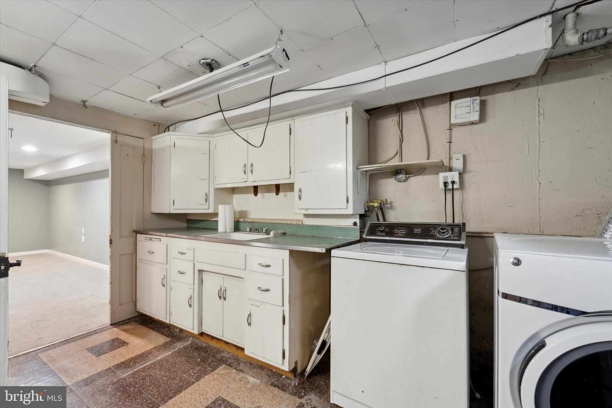 1718 Mt Pleasant Road Havertown, PA 19083 - Photo 24 of 30 a kitchen with stainless steel appliances granite countertop a sink a stove and cabinets