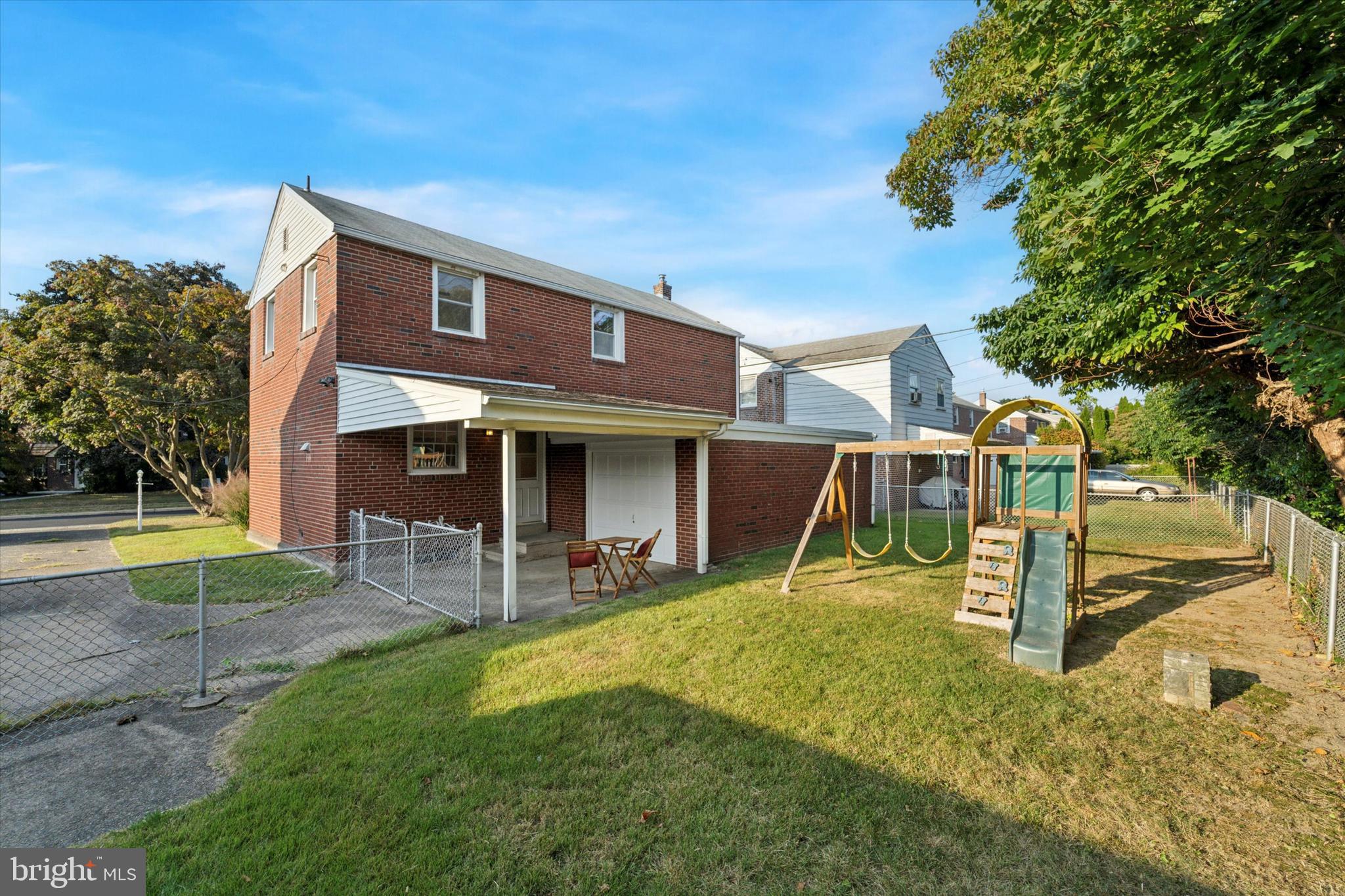 1718 Mt Pleasant Road Havertown, PA 19083 - Photo 26 of 30 a view of a house with a yard patio and a small yard