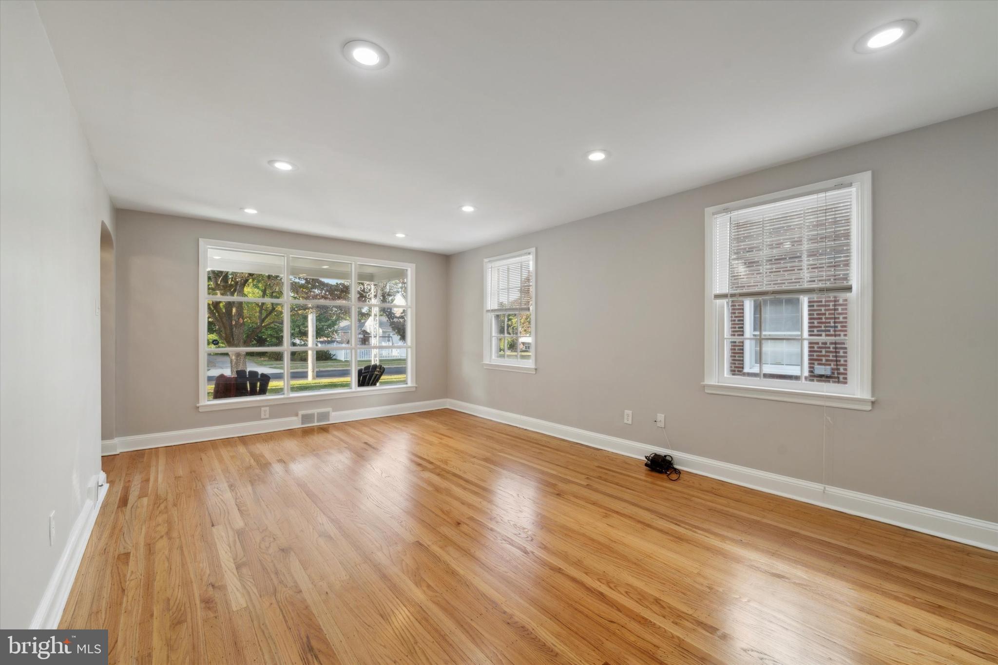 1718 Mt Pleasant Road Havertown, PA 19083 - Photo 3 of 30 a view of empty room with wooden floor and fan