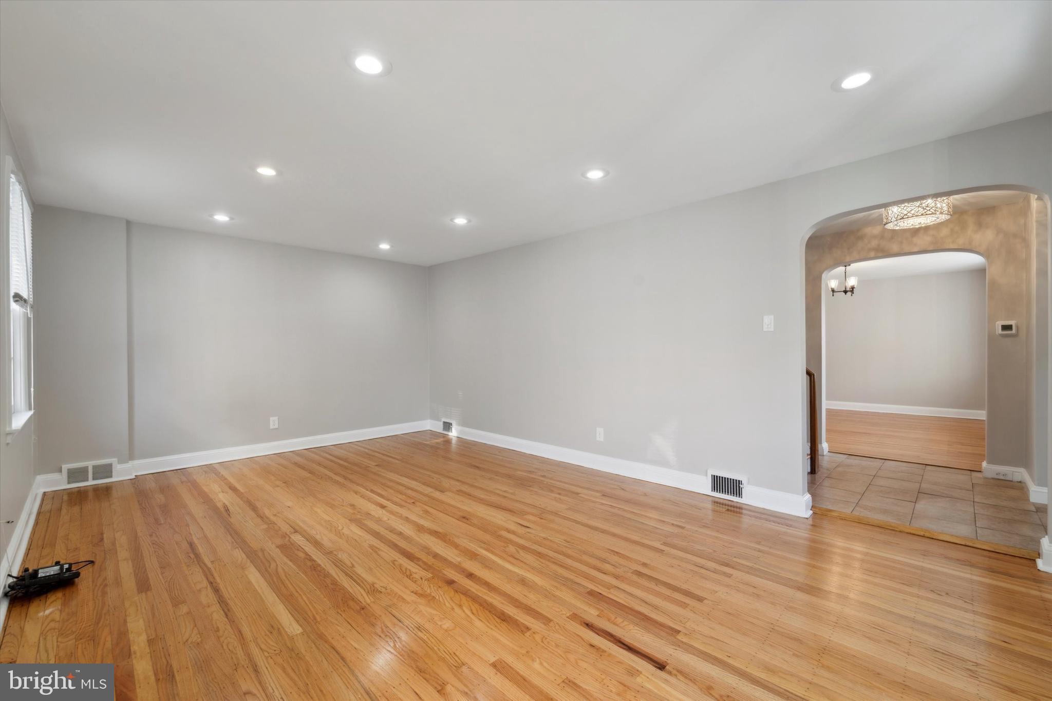 1718 Mt Pleasant Road Havertown, PA 19083 - Photo 4 of 30 an empty room with wooden floor and entrance
