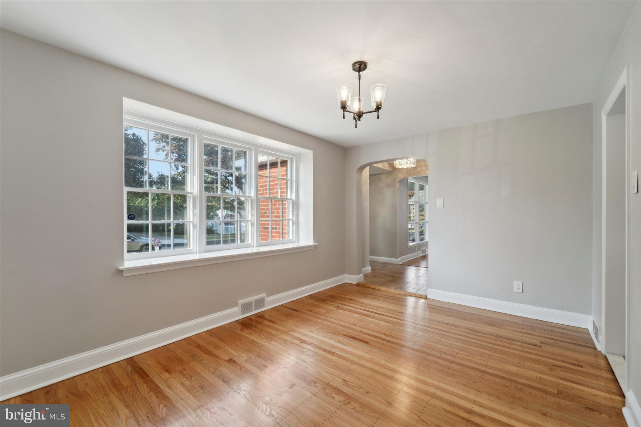 1718 Mt Pleasant Road Havertown, PA 19083 - Photo 5 of 30 a view of an empty room with wooden floor and a window