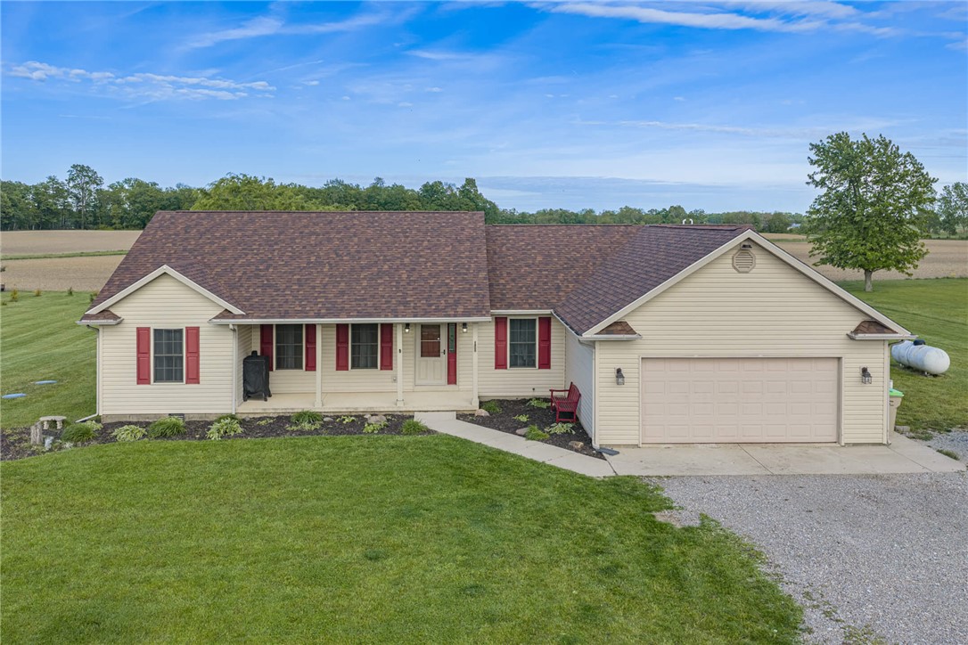 2645 Vance Road St. Paris, OH 43072 - Photo 30 of 35 Charming ranch home with welcoming front porch and attached garage, nestled on a verdant lot.