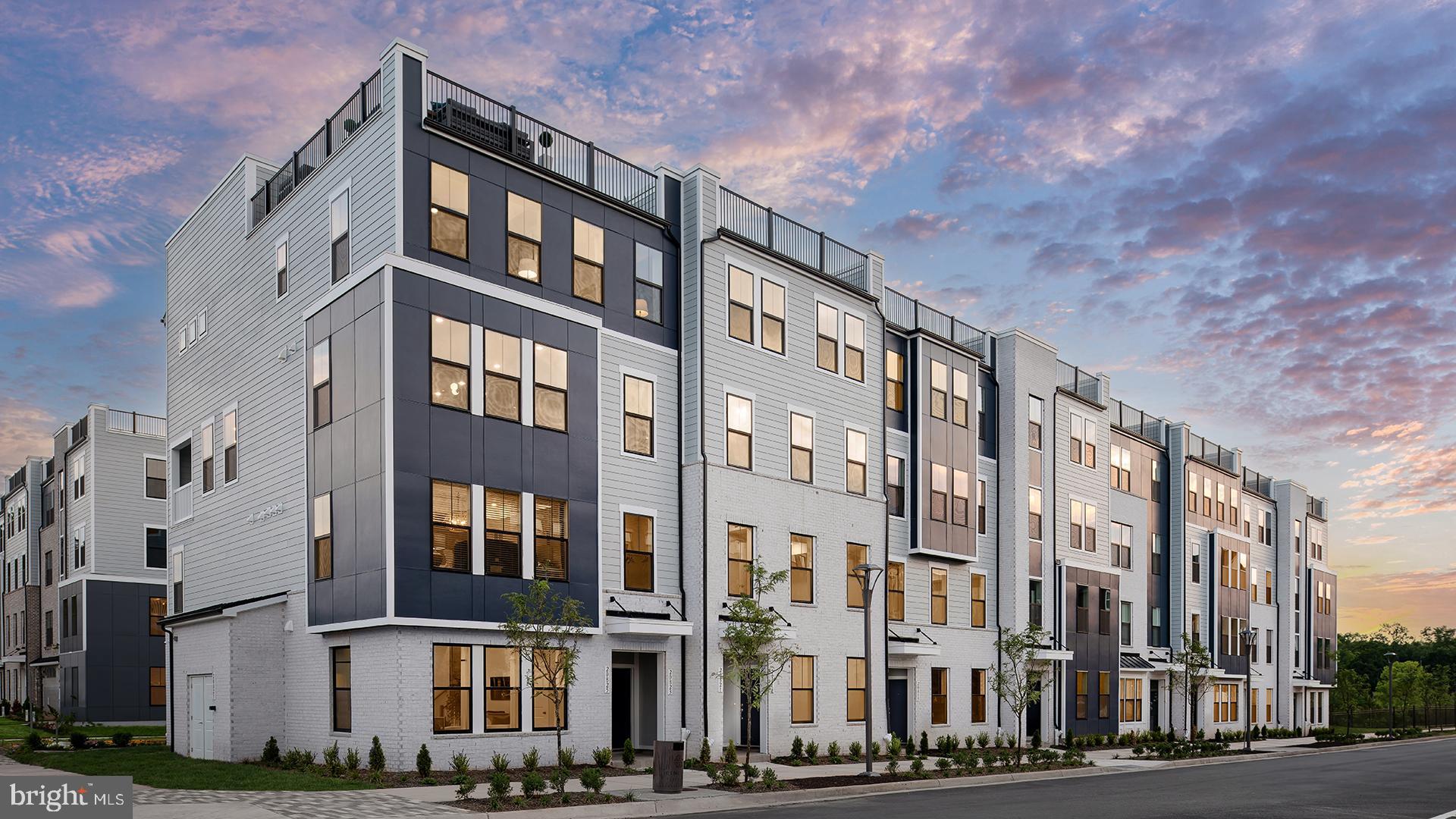 Tbb Cloongee Terrace, Unit CLARENDON Sterling, VA 20166 - Photo 1 of 14 a front view of a building with a street