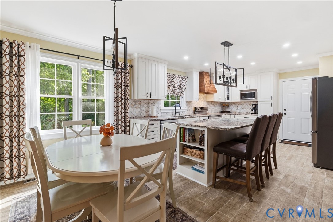 13411 Queensgate Road Midlothian, VA 23114 - Photo 7 of 37 Kitchen featuring white cabinetry, a central islan
