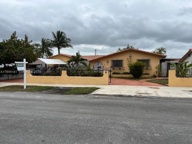9832 Southwest 27th Terrace Miami, FL 33165 - Photo 2 of 13 a view of a house with a yard
