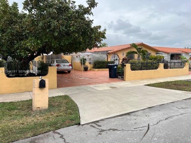 9832 Southwest 27th Terrace Miami, FL 33165 - Photo 3 of 13 a street view with residential house