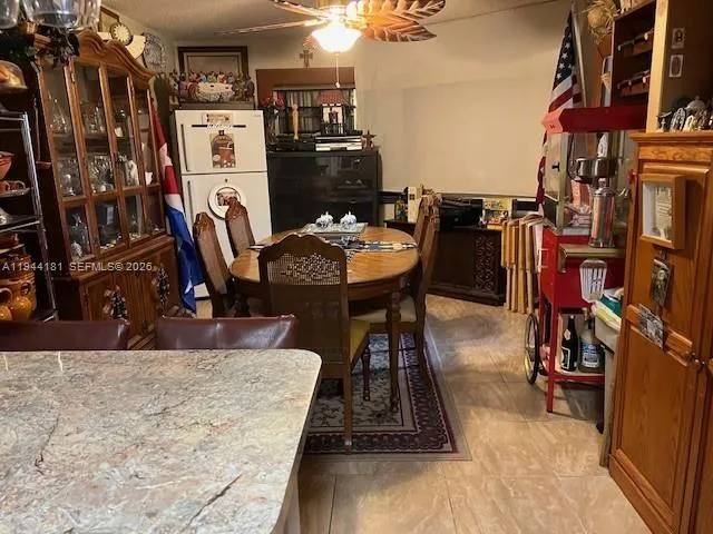 a view of a chairs and table in a patio