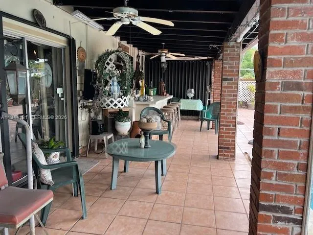 a view of an outdoor sitting area with furniture