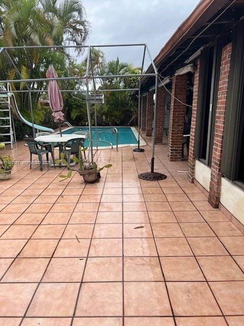 9832 Southwest 27th Terrace Miami, FL 33165 - Photo 10 of 13 a view of a terrace with seating space