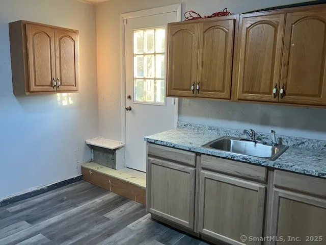 a kitchen with a sink and cabinets