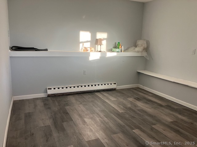 62 Brookfield Road, Unit 2 Waterbury, CT 06704 - Photo 4 of 10 a view of a kitchen with wooden floor and window