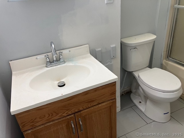62 Brookfield Road, Unit 2 Waterbury, CT 06704 - Photo 5 of 10 a white toilet sitting next to a bathroom sink