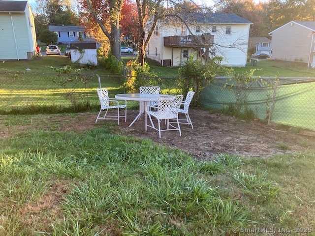 62 Brookfield Road, Unit 2 Waterbury, CT 06704 - Photo 10 of 10 a view of a chairs and table in the garden