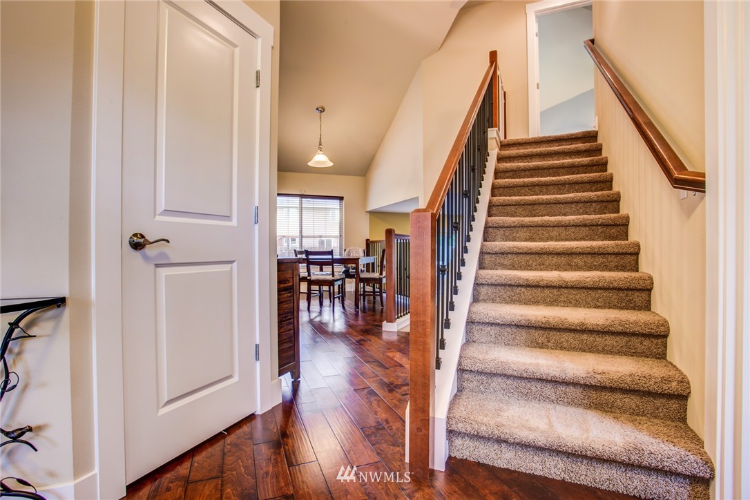 5117 Northeast 11th Street Renton, WA 98059 - Photo 2 of 19 a view of entryway and hall with wooden floor