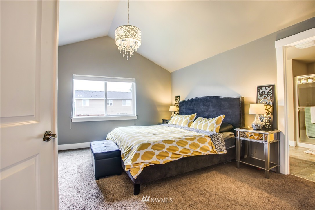 5117 Northeast 11th Street Renton, WA 98059 - Photo 11 of 19 a bedroom with a bed dresser and a window