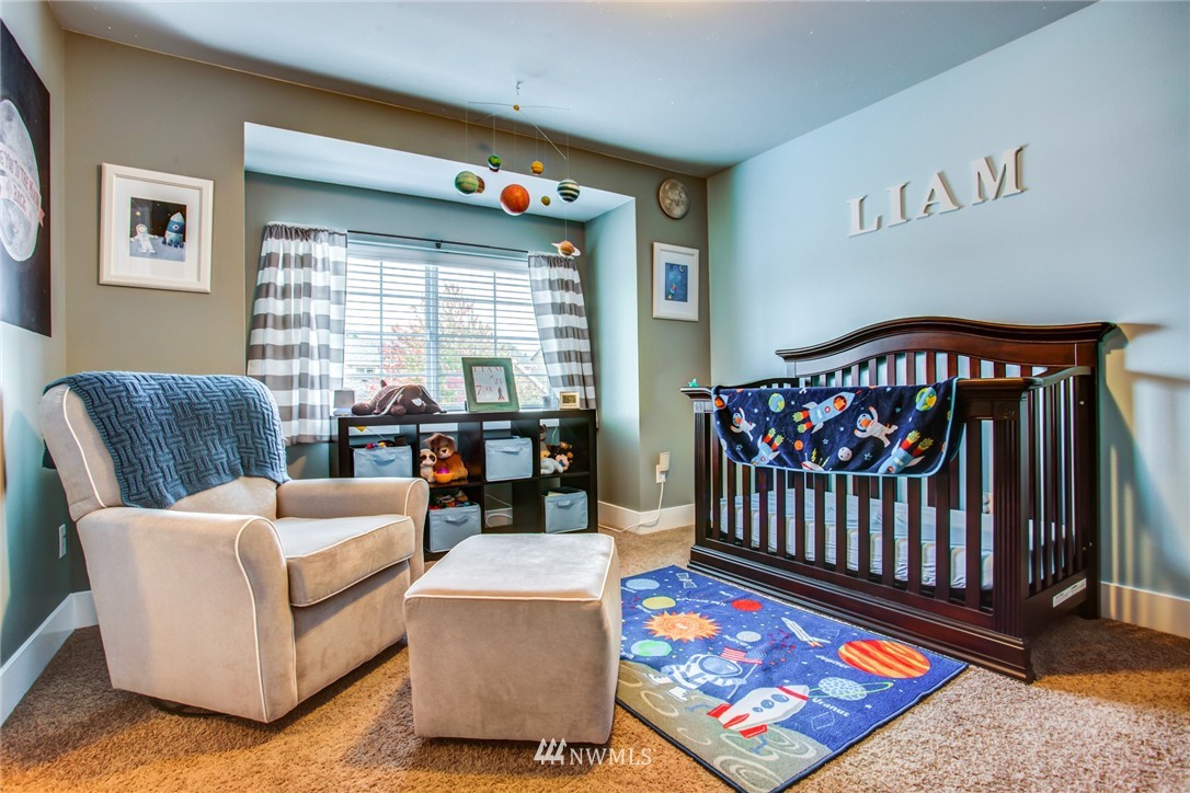 5117 Northeast 11th Street Renton, WA 98059 - Photo 16 of 19 a bedroom with furniture and a rug