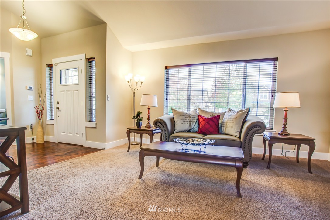 5117 Northeast 11th Street Renton, WA 98059 - Photo 3 of 19 a living room with furniture and a rug