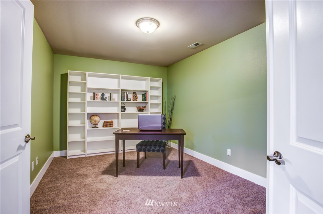 5117 Northeast 11th Street Renton, WA 98059 - Photo 9 of 19 a view of a workspace with furniture