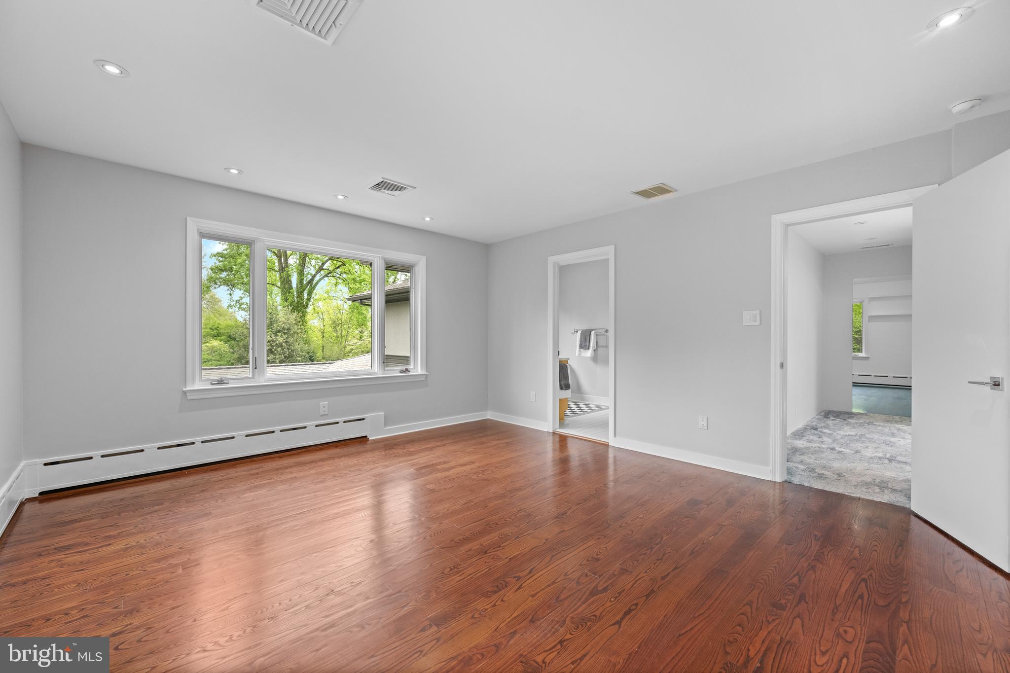 850 Lesley Road Villanova, PA 19085 - Photo 29 of 37 an empty room with wooden floor and windows