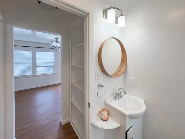 a bathroom with a sink and a mirror