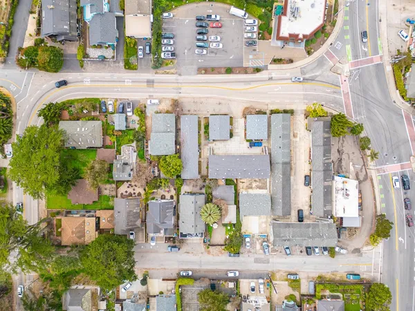 an aerial view of multi story building with yard