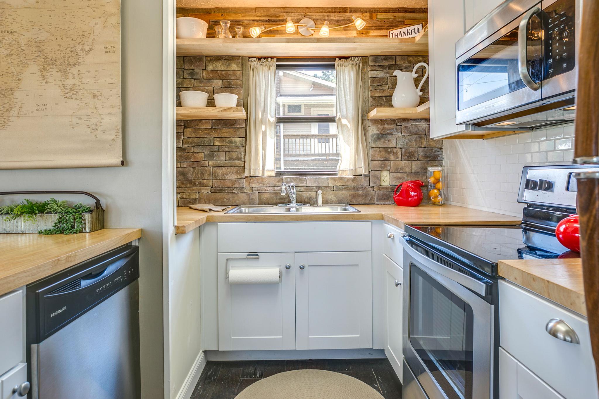 1692 Falling Water Road Sparta, TN 38583 - Photo 13 of 28 a kitchen with a sink cabinets and window