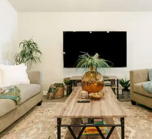 a living room with furniture and a flat screen tv