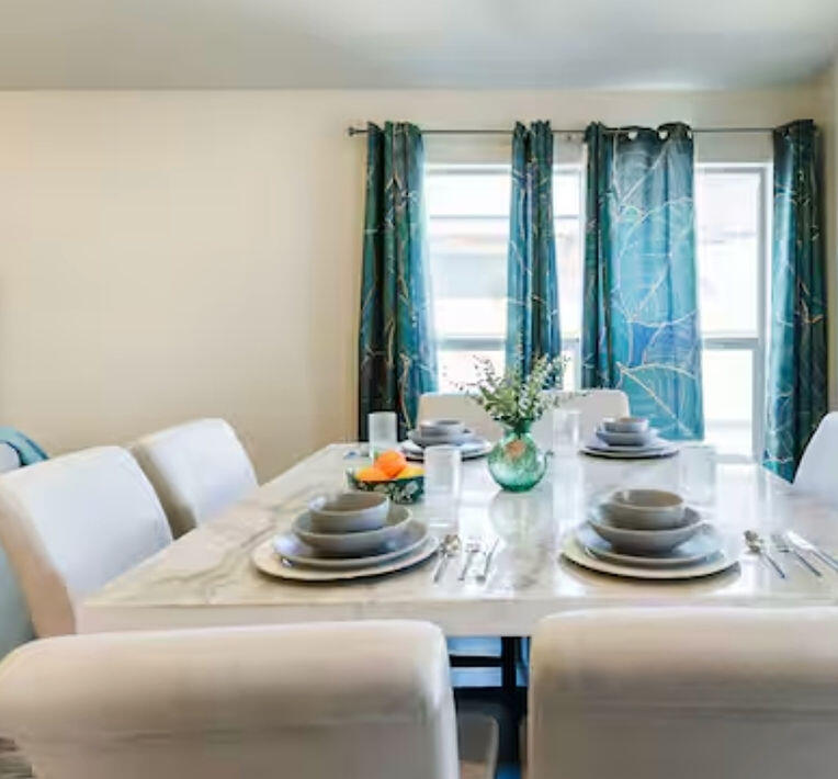 2016 132nd Street Lubbock, TX 79423 - Photo 19 of 28 a dining room with furniture and potted plant
