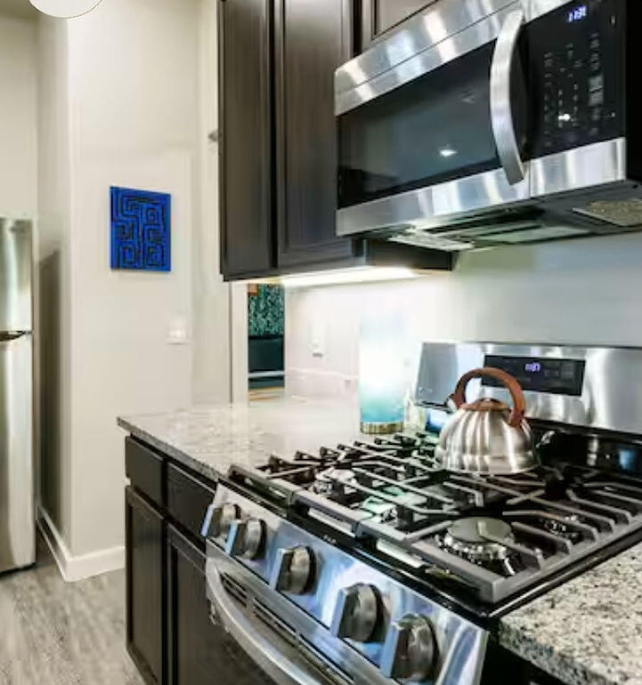 2016 132nd Street Lubbock, TX 79423 - Photo 22 of 28 a stove top oven sitting inside of a kitchen