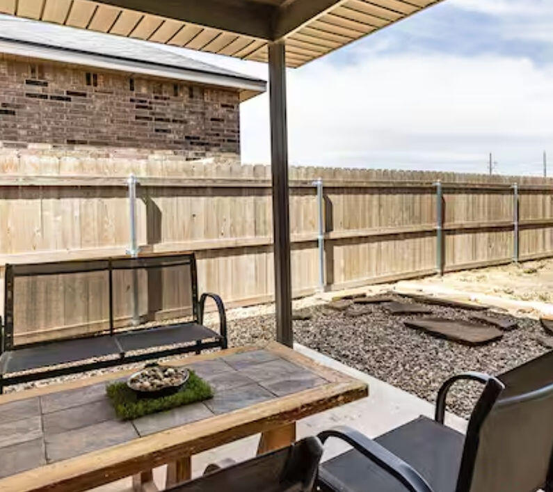 2016 132nd Street Lubbock, TX 79423 - Photo 6 of 28 a living room with furniture and a floor to ceiling window
