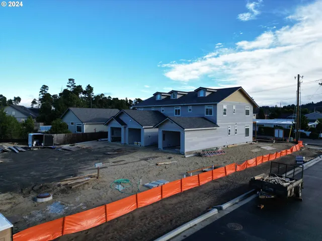 a view of house with outdoor space and sitting area