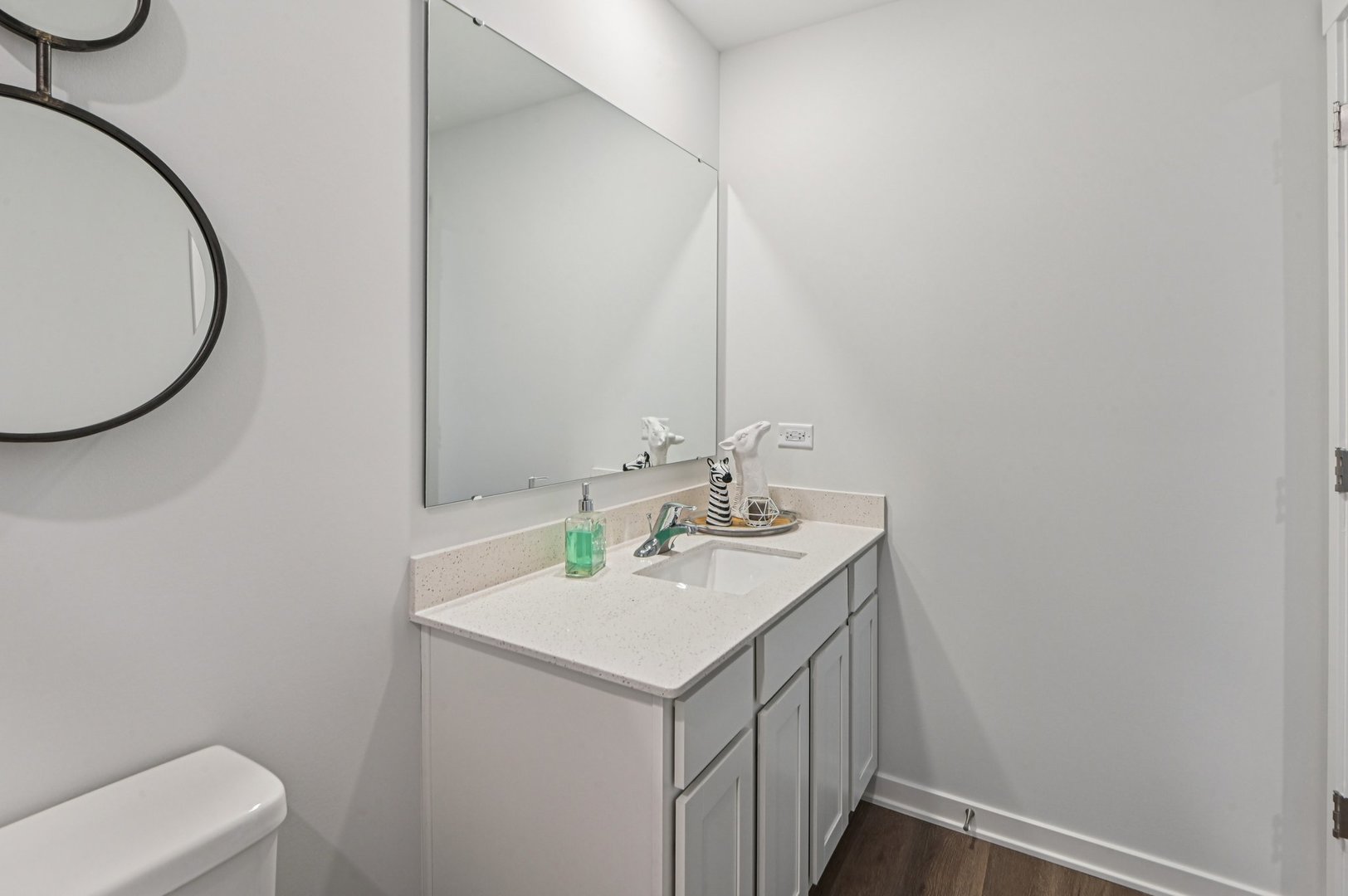 6717 Applegate Drive Plainfield, IL 60586 - Photo 19 of 30 a bathroom with a sink a toilet and a mirror