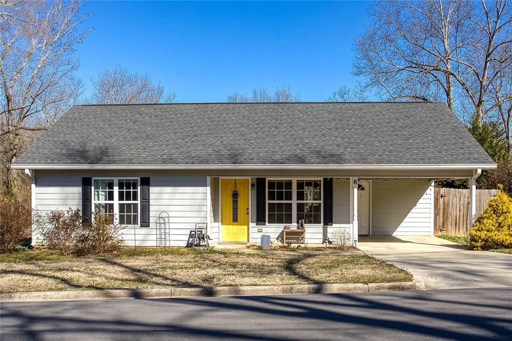 a view of house with backyard