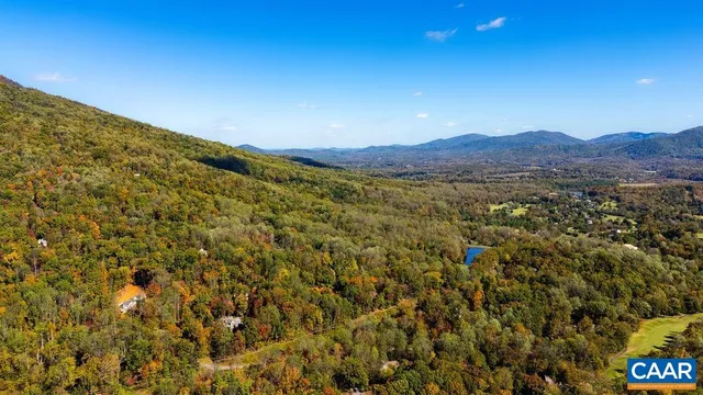 a view of a and mountain in a field