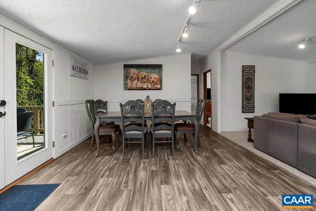 a view of a livingroom with furniture window and wooden floor
