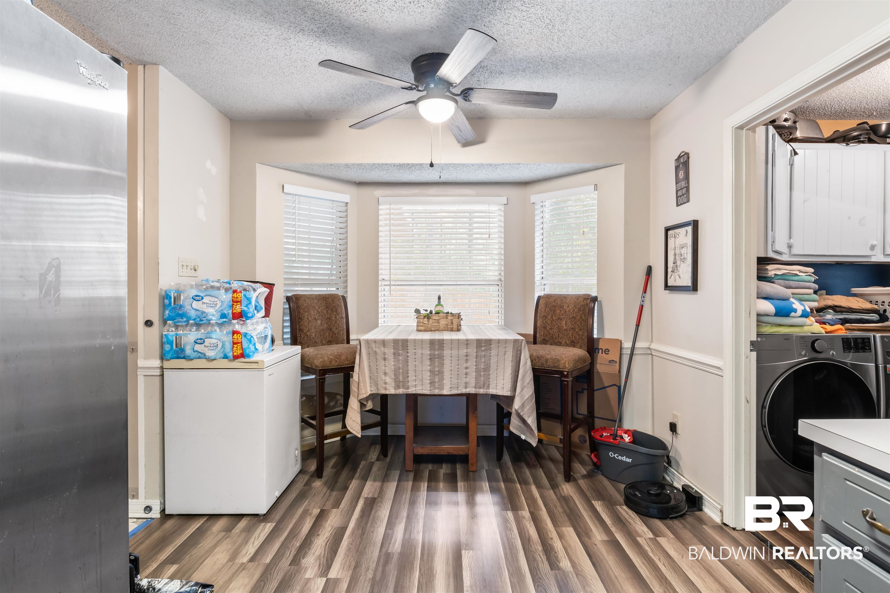 1345 Baker Court Mobile, AL 36695 - Photo 5 of 28 Interior space with a textured ceiling, dark hardwood / wood-style flooring, washer / dryer, and ceiling fan
