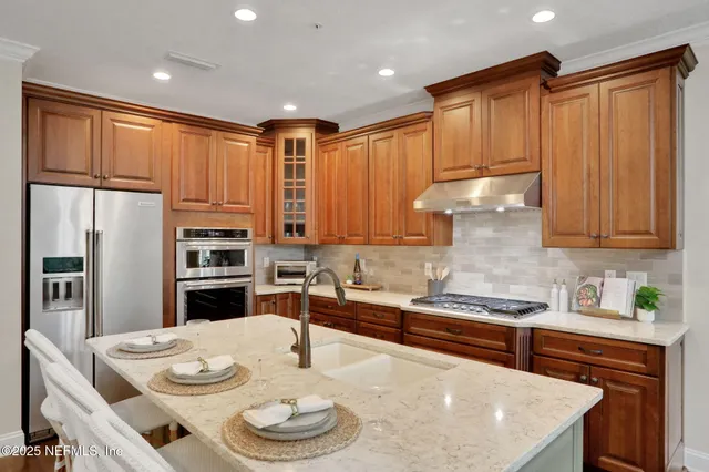 a view of a house with backyard porch and sitting area