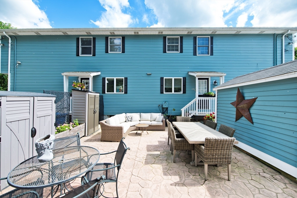 16 Warren Avenue Newton, MA 02465 - Photo 2 of 42 a patio with table and chairs