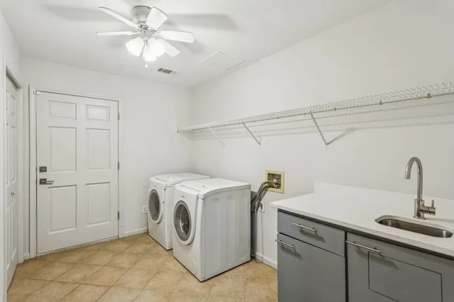 a view of a kitchen with furniture and windows