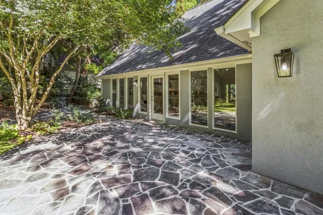 a front view of house with yard and green space